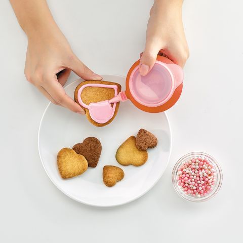 Puzzle Hearts Cookie Cutter 12 heart-shaped cookies with one cut of the dough.