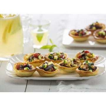 Courgette, dried tomato and black olive tartlet