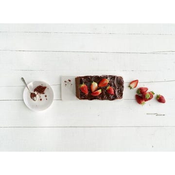 Chocolate plum cake with strawberries